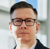 Alexander Hughes, CEO di un'azienda di trading crypto, ritratto